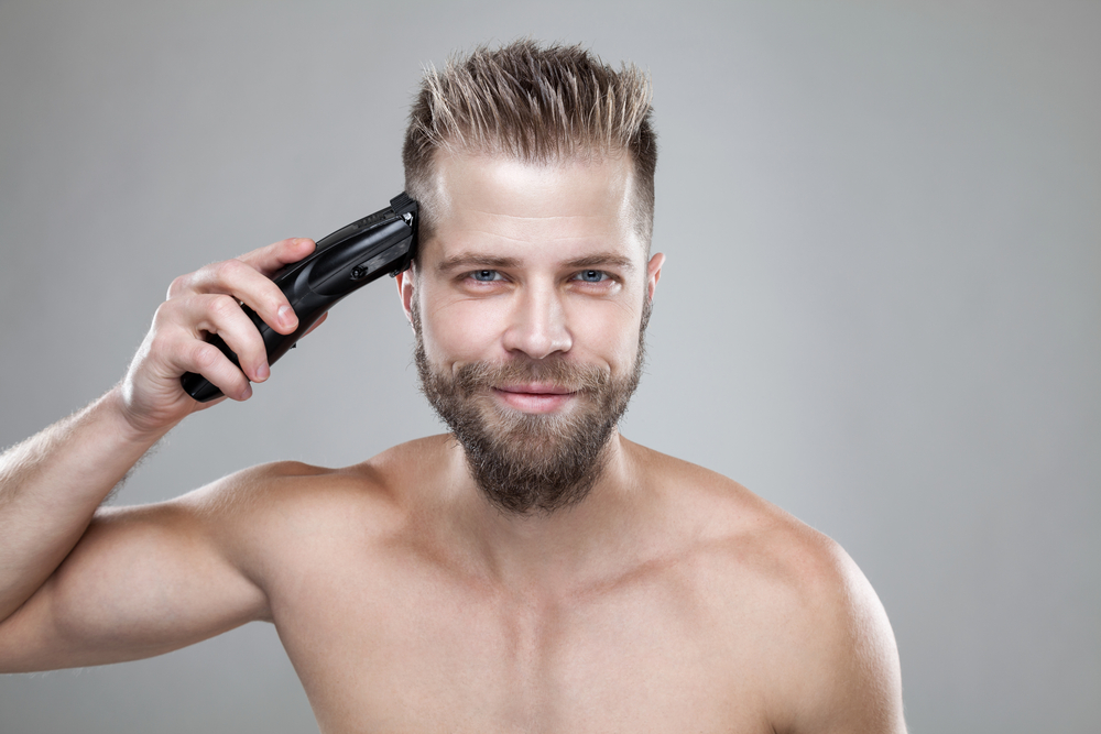 best hair clippers - man clippering hair